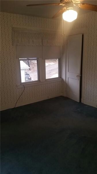 Bedroom #2 with ceiling fan and walk in closet