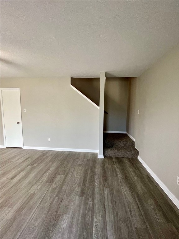 Spare room with hardwood / wood-style flooring and