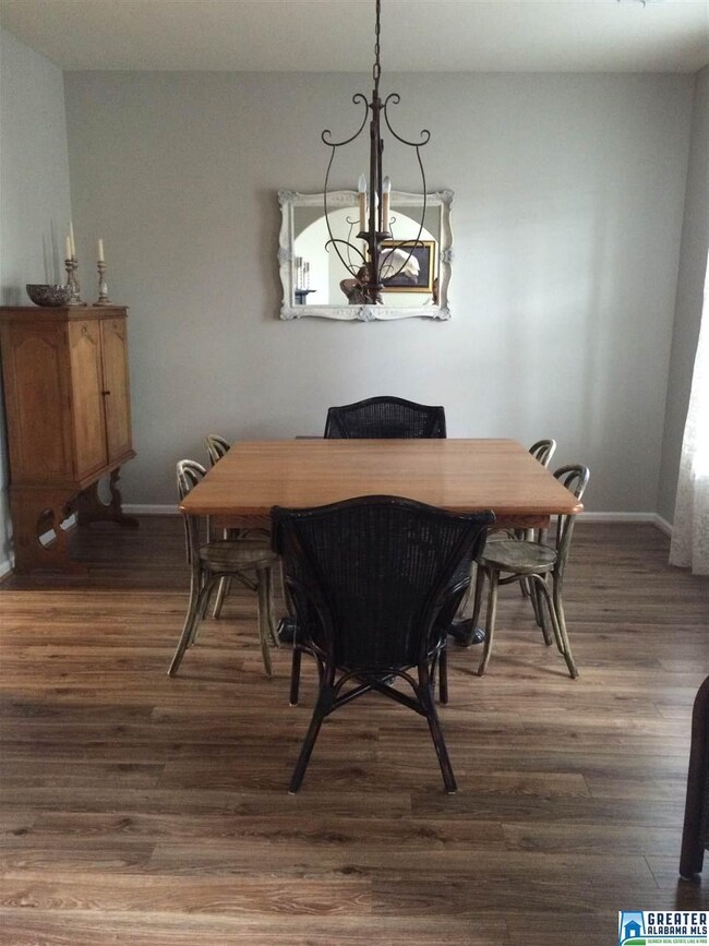 Beautiful  flooring, a gorgeous light fixture plus