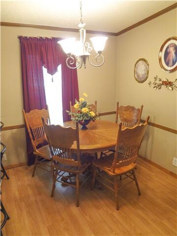 This dining area offers plenty of room for a family to enjoy a home cooked meal together. 