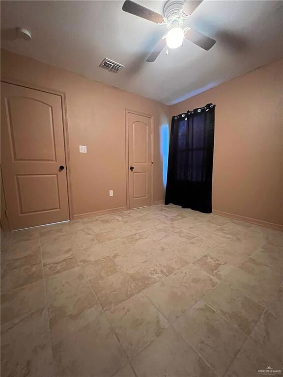 Empty room with ceiling fan