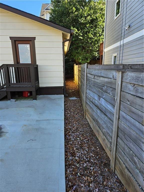 View of home's exterior with fence