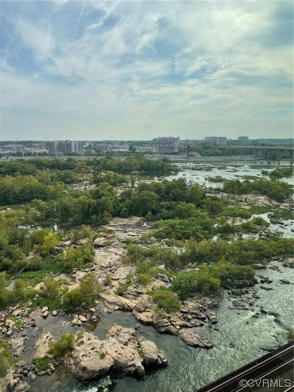 Birds eye view of property featuring a water view