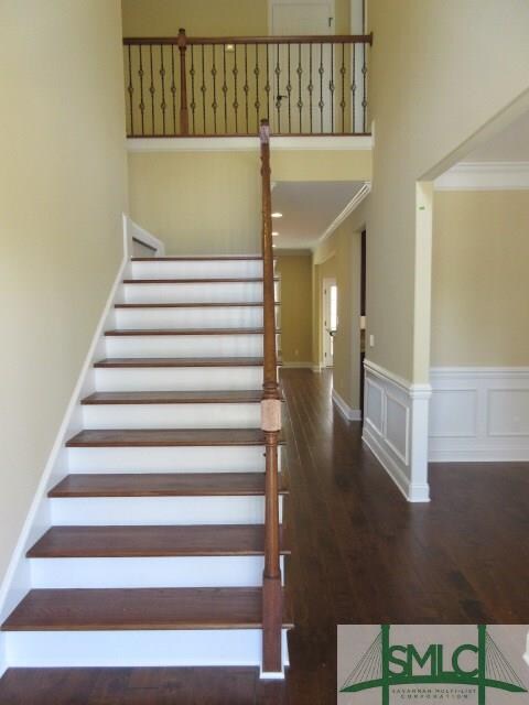 Grand Foyer Entry with Wrought Iron Balusters and 