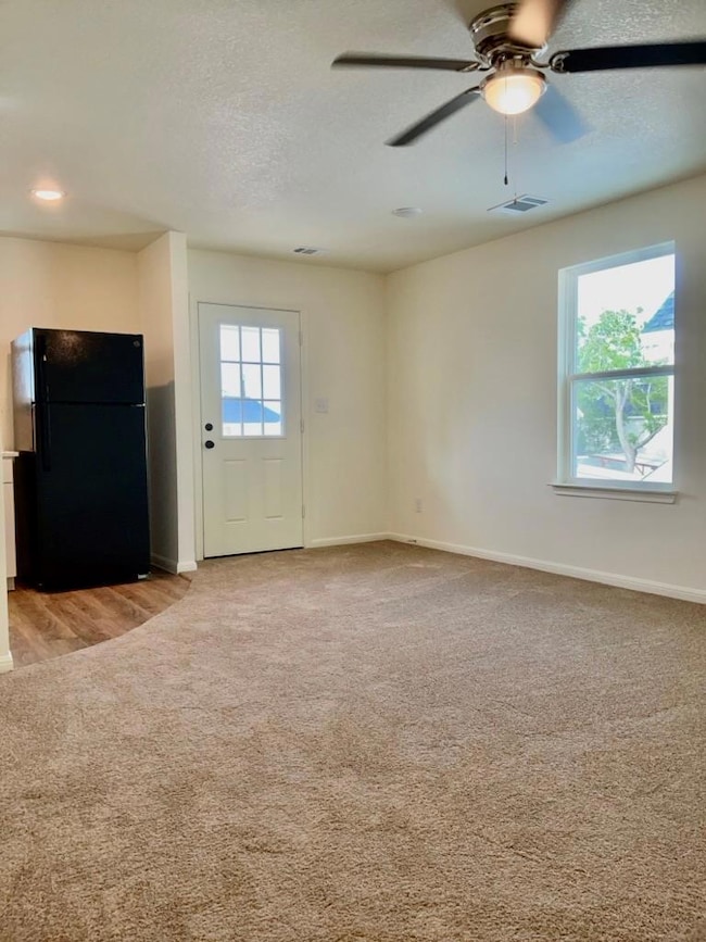 Unfurnished living room featuring plenty of natur
