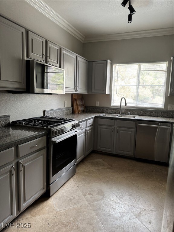 Kitchen featuring a sink, dishwashing machine, cro