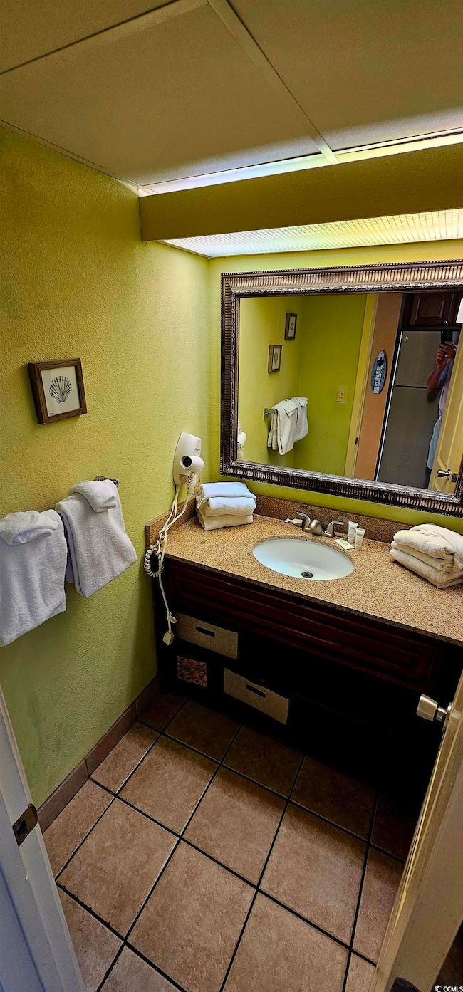 Bathroom featuring vanity and tile patterned floor