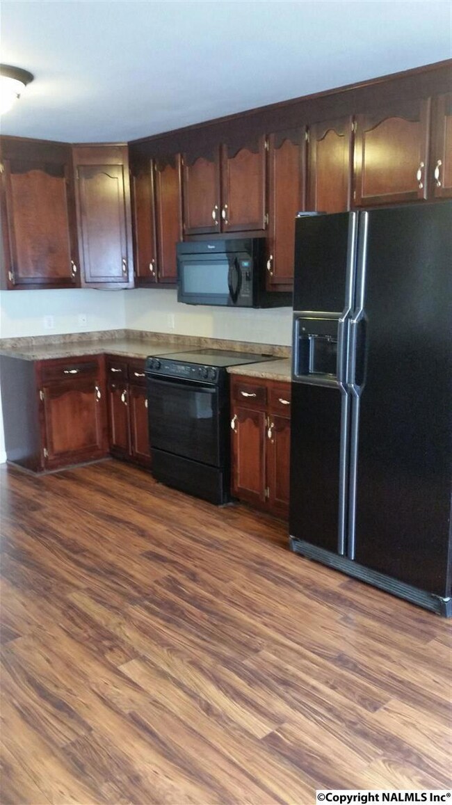 New laminate wood floors,abundance of cabinets & counter space,under counter lighting,fresh paint,appliance pkg, new light fixtures, Eat in area. Refrigerator negotiable.