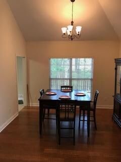 Beautiful dining area with great view of the deck and small creek, tall spacious ceilings 