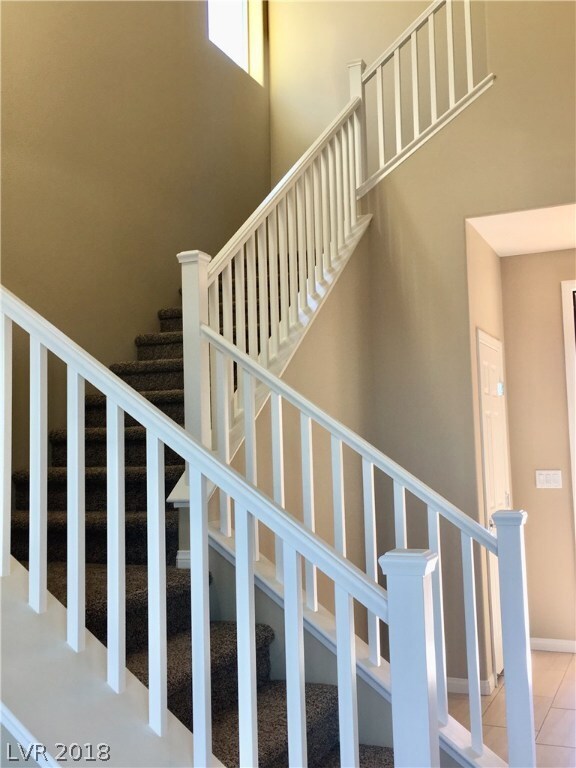 White Mission-style handrails compliment this uniq