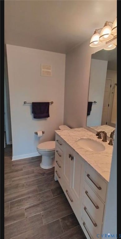 Bathroom with vanity and wood finish floors