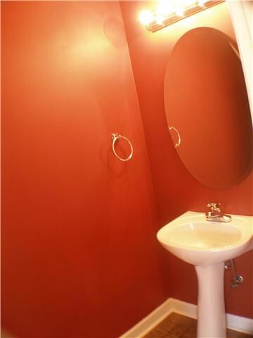The half bath is off of the great room and has pedestal sink.