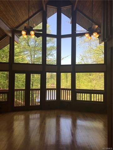 Tall ceilings and expansive windows allow for year round gorgeous views that overlook your pond.