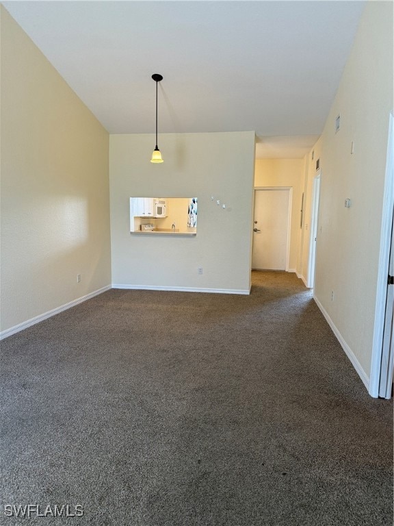 living room featuring carpet flooring and baseboar