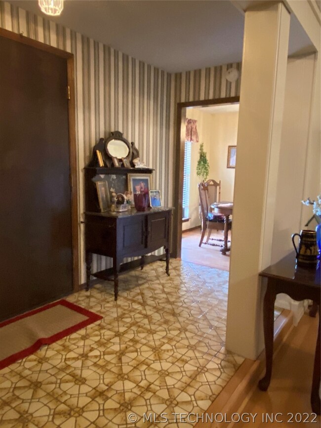 FOYER WITH VIEW OF FORMAL DINING AREA