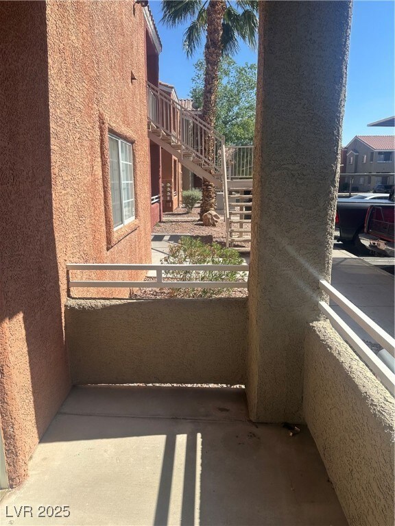 Balcony featuring stairs