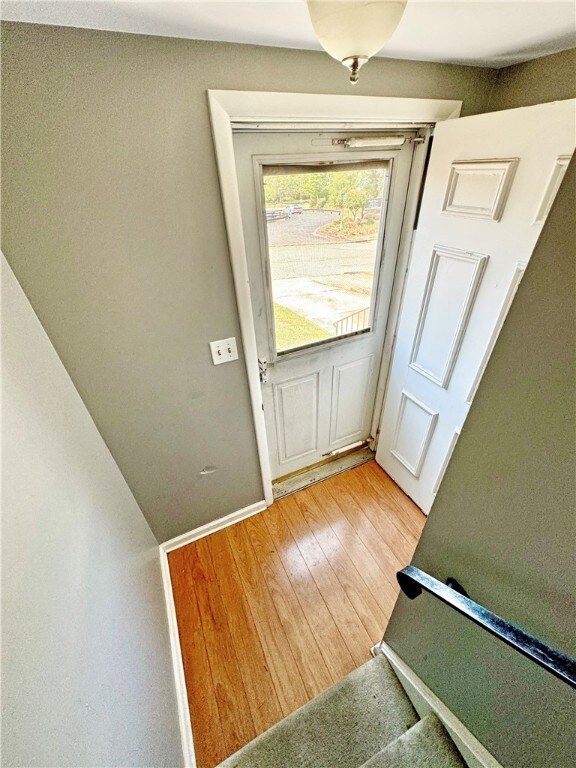 Entry leads down the garage & basement/laundry or