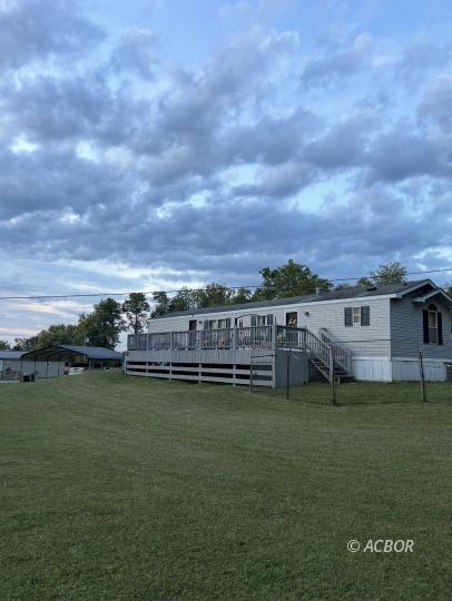 Mobile home and carport