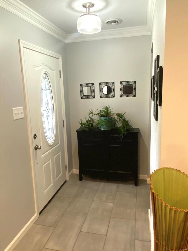Welcome inside!  Great foyer with tiled floors, up