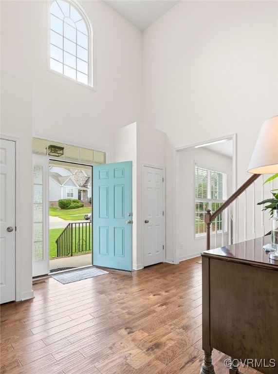 Stunning 2-story foyer with hardwood floor through