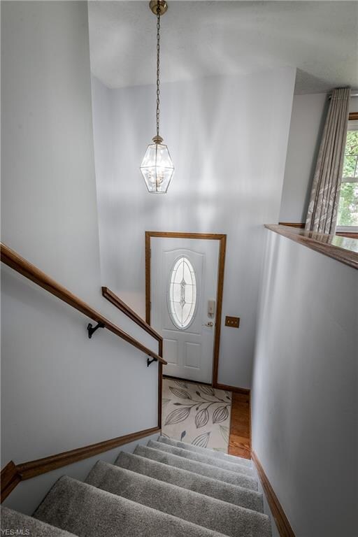 The stairs lead to the living room
