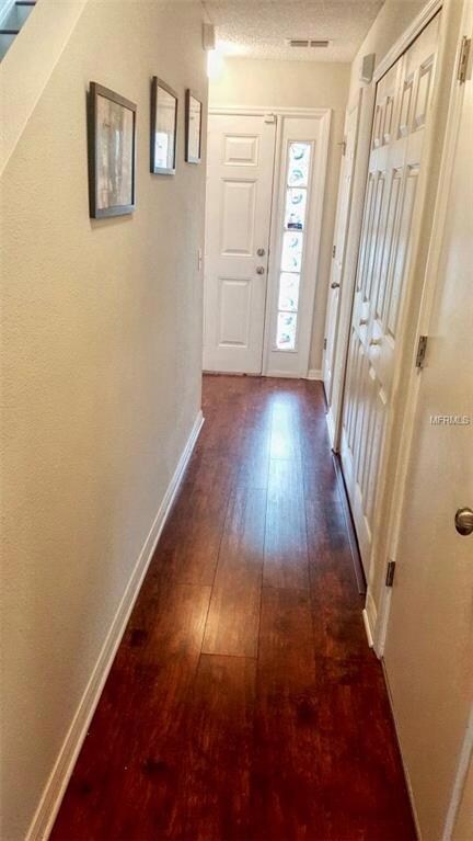ENTRY. NEW LAMINATE FLOORS AND NEW PAINT THROUGHOUT THE HOUSE