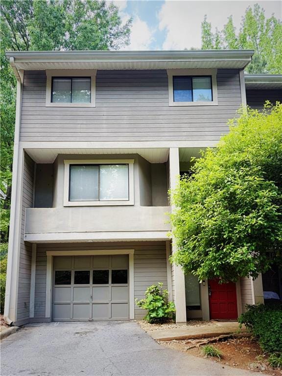 View of front of house featuring driveway and an a