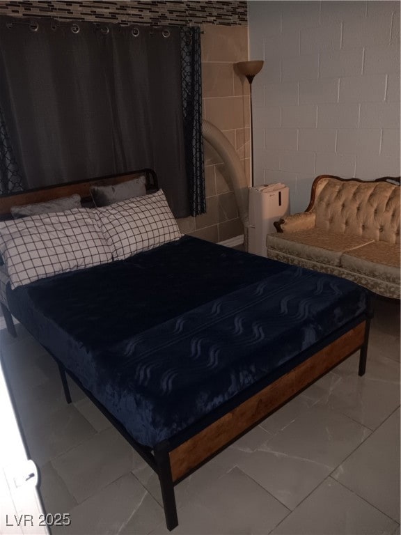 Bedroom featuring marble finish floor