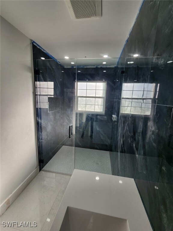 Bathroom with an enclosed shower