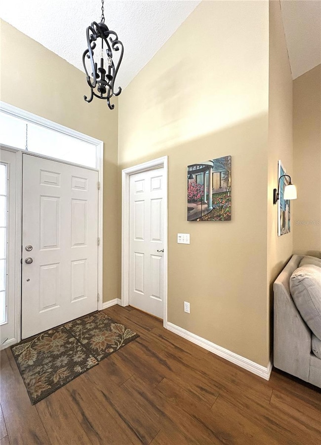 Close up of entry with door to laundry room and garage