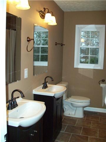 Double vanities in both bathrooms. Tile flooring.
