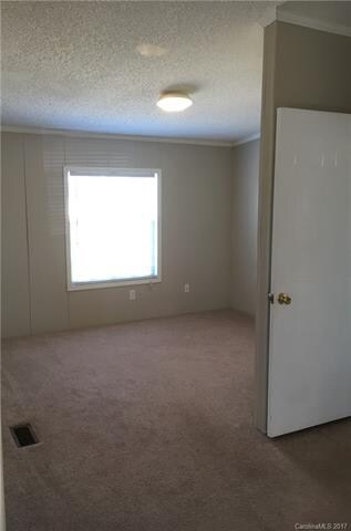 Just as you enter the master bedroom, to the right