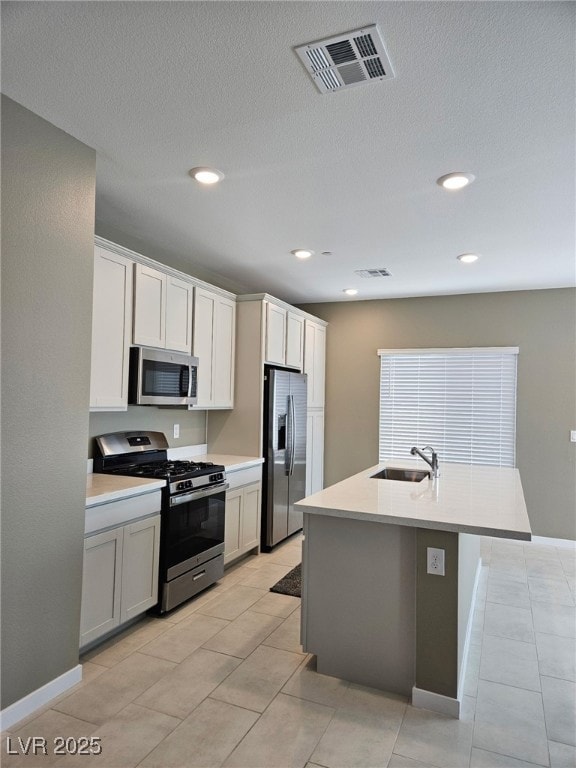 Kitchen featuring stainless steel appliances, a si