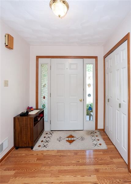 Upon entry opens into a large foyer with huge coat