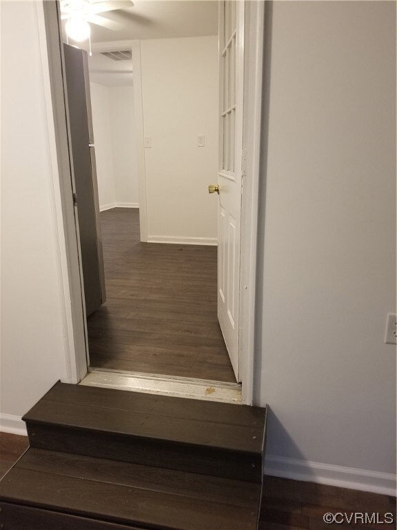 Interior space featuring dark wood-type flooring