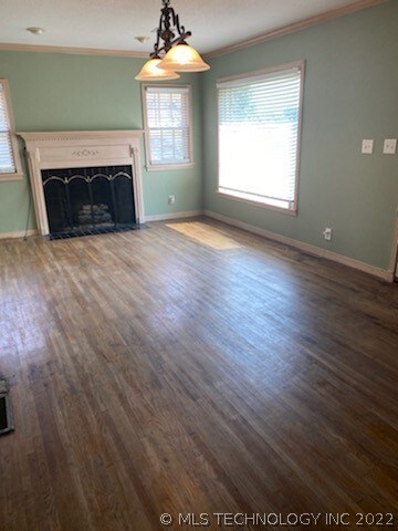 Large front living area with original hardwood flo