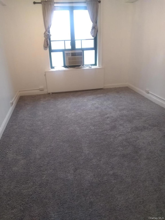Bedroom with dark colored carpet