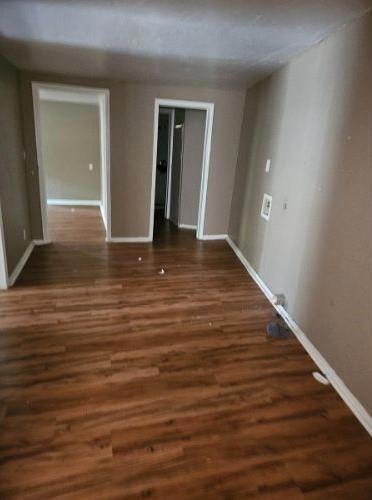 Unfurnished room featuring hardwood / wood-style f