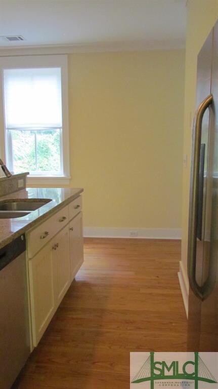 Kitchen area includes, refrigerator, microwave, ov