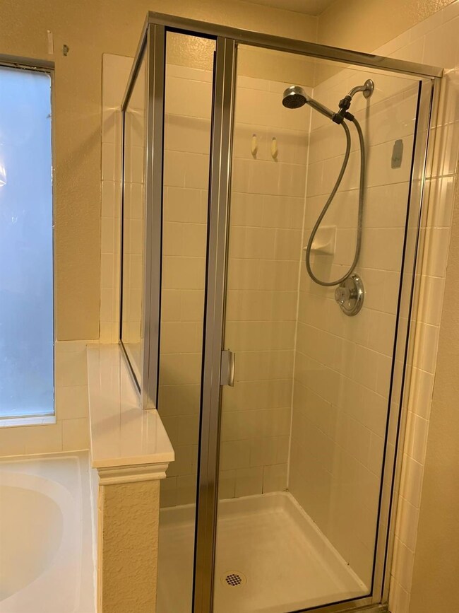 Bathroom with a shower with shower door