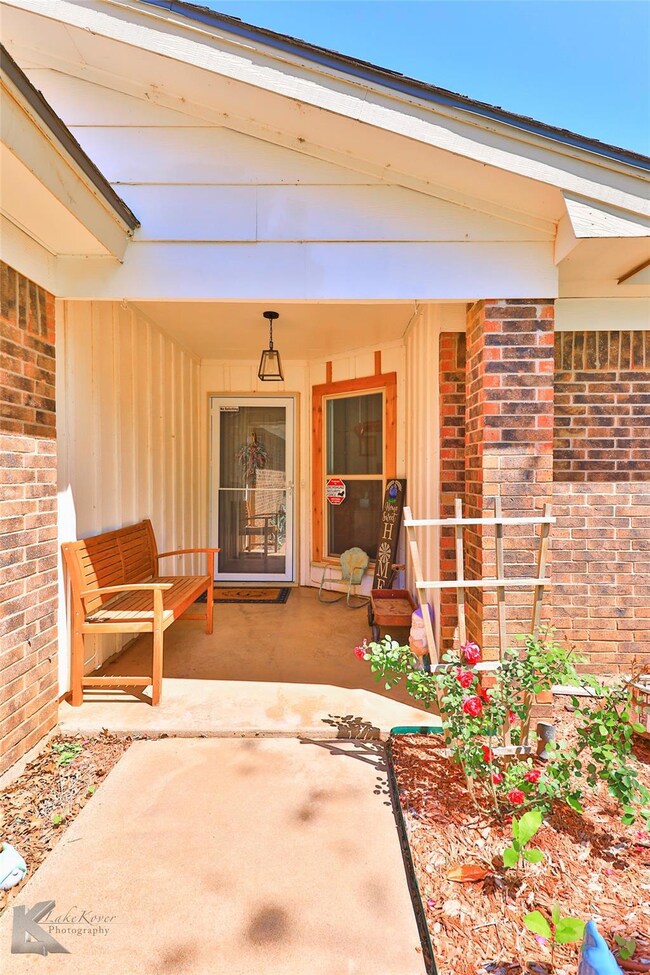 Doorway to property featuring a porch