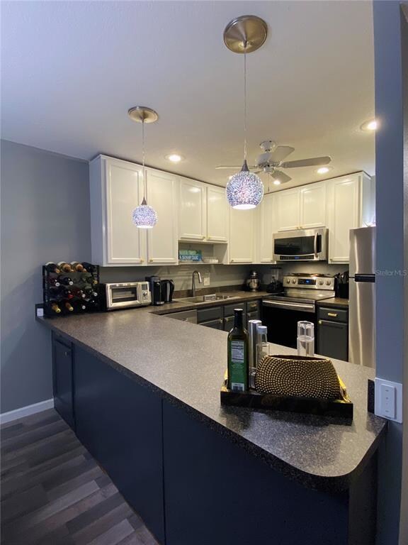 View of open kitchen from entry into great room