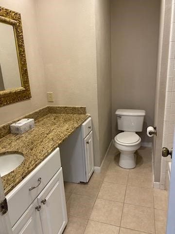 Full bathroom featuring vanity and light tile patterned flooring