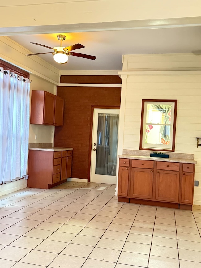 Kitchen featuring light tile patterned floors, bro