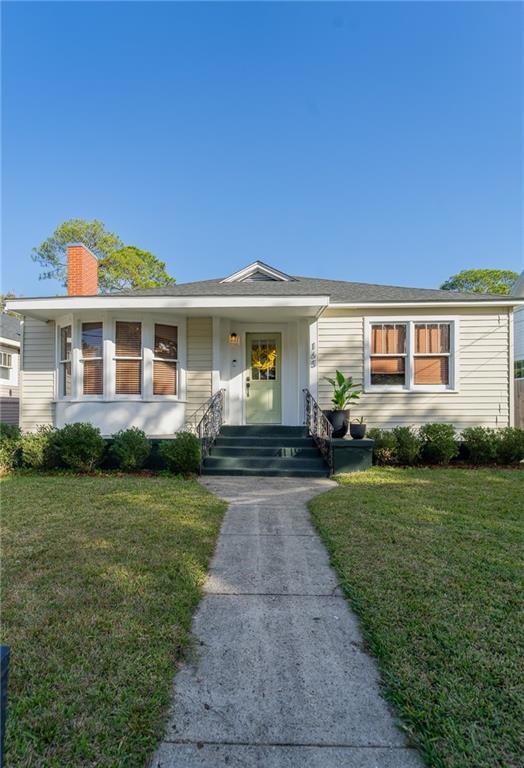 Ranch-style home with a front yard