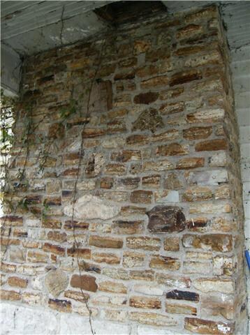 One of three fireplace chimneys.  This one is on the side porch.  It's made up of fossils and rocks from the creek and looks like a work of art.
