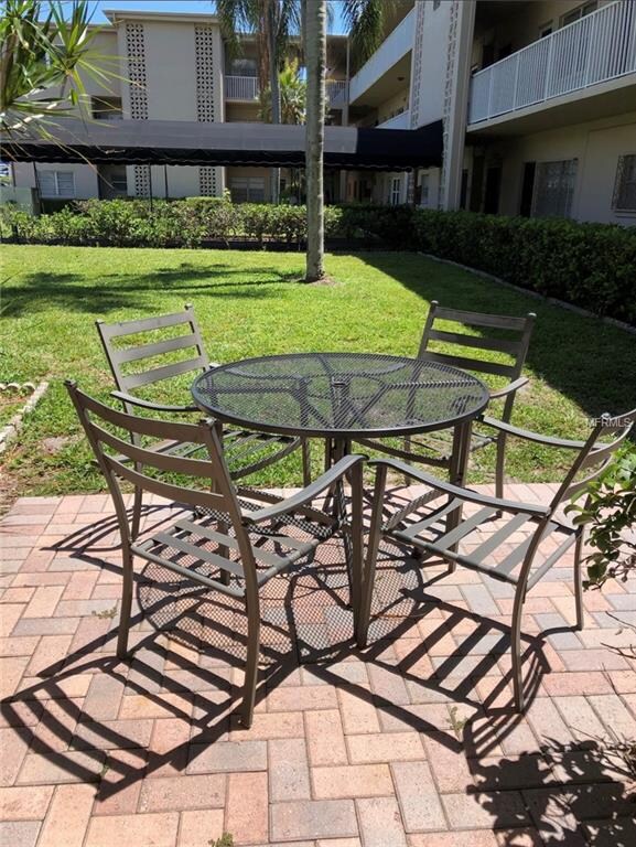 Relax on the common area patio with neighbors or f