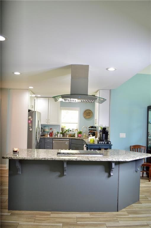 Kitchen featuring a kitchen breakfast bar, island 