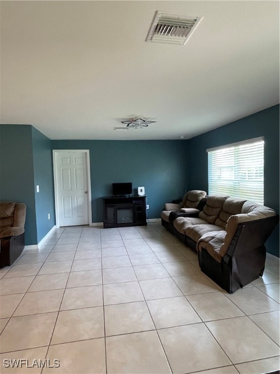 Living room featuring light tile patterned floorin