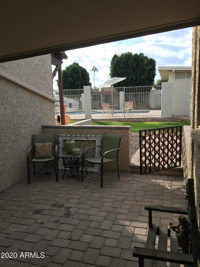 Private patio area overlooks pool